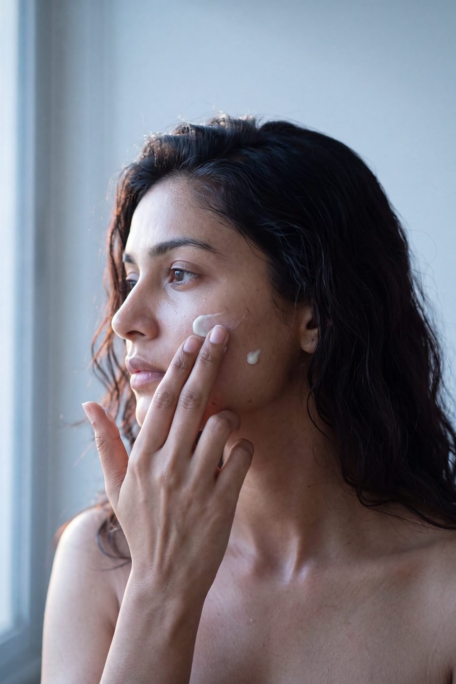 Applying BLEMISH day cream to clean skin
